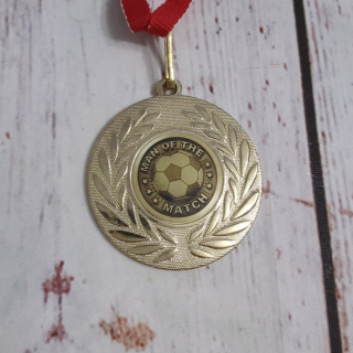 Medal piłkarski MAN OF THE MATCH - złoty z listkami