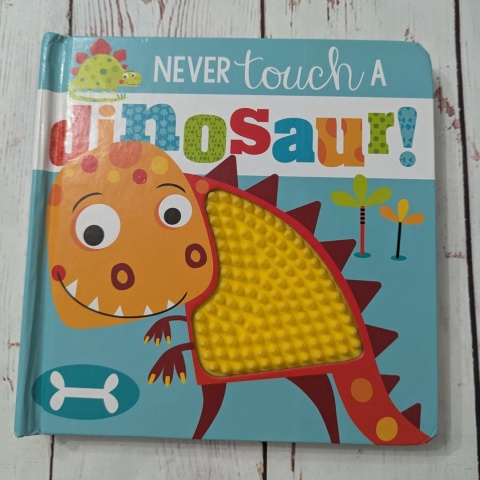 Książka Never Touch a Dinosaur - sensoryczna książka po angielsku UŻYWANA