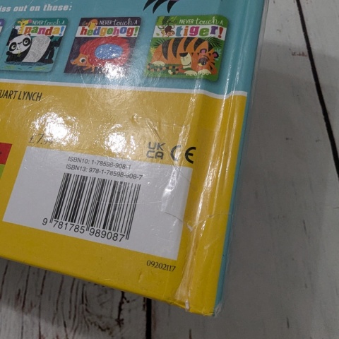 Książka Never Touch a Dinosaur - sensoryczna książka po angielsku UŻYWANA